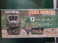 Front packaging showing Rexing Trail Camera branding, key features including 12 months standby, IP56 water resistance, 0.2 second reaction, triple PIR, super wide angle, 20M detect IR sensor, automatic temperature compensation, and hunting camera images.