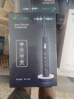 Boxed Safcare Sonic Electric Toothbrush Model SC-201, showing front of retail packaging with product image and features.