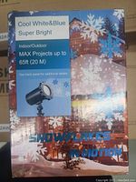 Photo of packaging showing product name and details: cool white & blue light, indoor/outdoor, max projection distance 65ft (20m).