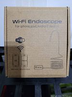 Photo of the Wi-Fi Endoscope retail box showing product compatibility and Wi-Fi connection information.