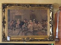 Full view of the oil painting and its gilt carved wood frame mounted on wall
