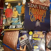 View showing Barbie & Ken doll set with Star Trek characters on box, tags visible indicating Star Trek branding.