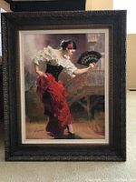 Full view of framed artwork showing Spanish dancer and ornate frame