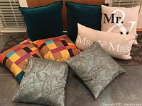 Overview of all four pillow sets showing colors, patterns and text details