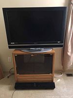 Sony KDL-V40XBR1 TV on oak TV stand, Energy soundbar in front