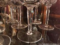Close up photo of the base and stem of the Waterford crystal wine glasses showing intricate cut design and clear crystal.
