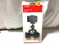 Front view of sealed retail box of Joby GripTight ONE Mount showing product and brand.