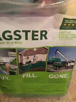 Front side of the Bagster waste disposal bag packaging showing brand name, usage steps, and promotional images for buy, fill, and waste collection.