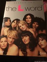 Front cover of The L Word Season 2 DVD showing cast members in a group portrait style photo