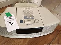 Top view of the white Bose Wave Radio showing numeric keypad and control buttons, no remote included