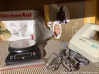 KitchenAid meat grinder box, digital kitchen scale, VillaWare Rose Bouquet Waffler box, Black & Decker mixer with beaters and cord