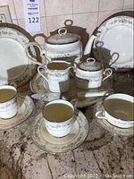 Full display of Noritake tea set and platters on countertop
