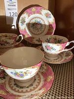 Three Royal Albert Lady Carlyle bone china teacup and saucer sets displayed