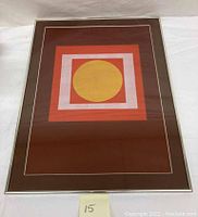 Front view of framed abstract geometric artwork showing concentric shapes