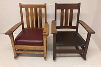 Pair of oak rocking chairs side by side on white floor