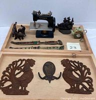 Wide shot of all items on wooden tray for overall view of lot contents