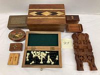 Overview of all wooden boxes, mini chess set open box with pieces, and carved wooden book stand