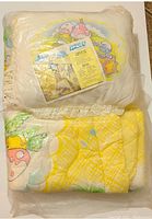 New vintage Smurfs comforter and pillow set in original plastic packaging. Plastic is partially split, but contents appear intact.