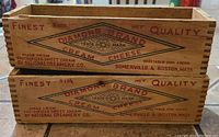 Pair of vintage Diamond Brand cheese boxes stacked, showing logos and text on the sides.