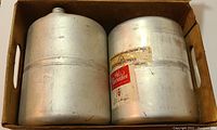 Metal mini keg with Old Milwaukee label showing light wear.