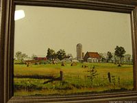 Framed watercolor showing a rural farm scene with barn and silo