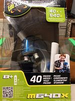 Front view of boxed Edu-Science microscope showing branding and magnification info (40x-640x).