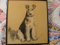 Full view of the framed pastel drawing showing a seated dog against a tan background.