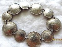 Top side of the bracelet showing Queen Wilhelmina profile on each linked coin.