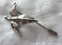 Close up view of the bird in flight stickpin front showing detailed wings and body