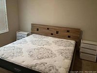Full view of king bed frame, headboard and mattress