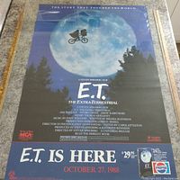 Full view of the vintage E.T. movie poster, showing the main artwork, title, release date and promotional pricing graphic.