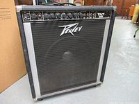 Full front view of the Peavey TNT 130 amplifier showing brand logo and front grill.