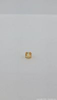 Octagon cut natural golden citrine gemstone shown from top and angled views against plain white background.