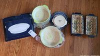 Full view of the set including large bowls, rectangular dishes, smaller plates, oval platter box