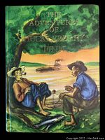Front cover of the book showing colorful painted scene with two boys by a river, fish on ground, and steamboat in background with title in gold lettering.