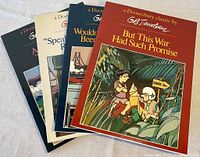 Four Doonesbury classic comic books displayed fan-wise, showing colorful cover illustrations and titles.