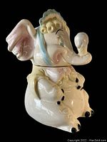 Another angled side view accentuating the glossy finish and detailed toes and ears.