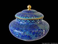 Front and side view of the blue vintage cloisonné lidded jar showing floral and scroll enamel designs in blue tones with gold outlines.