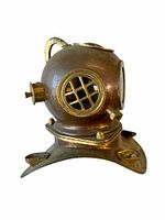 Front perspective image of the small model diving helmet showing the window with metal grid and part of the flange base.