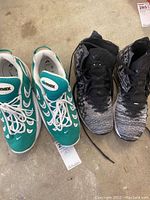 Pair of Nike Air Max sneakers and Lebron basketball shoes side by side, viewed from above.