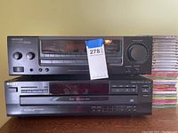 Front view of Kenwood receiver on top and Sony CD player below, showing model and controls.