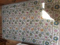 Top view of the 5 x 7 area carpet showing floral pattern and condition
