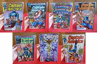 Front covers of seven Captain America Marvel Comics, featuring various issues from 1977 to 1999. Shows detailed and colorful artwork with characters and titles clearly visible.