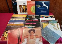 Photo showing the front covers of assorted vintage vinyl records in protective sleeves
