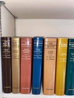 Books arranged on a shelf showing spines with titles and illustrator credit to N.C. Wyeth.