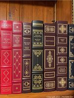 Shelf view showing The Red and the Black, Tales of Edgar Allan Poe, Treasure Island, Selected Plays, Ulysses, Vanity Fair