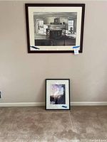 Image showing both framed prints on wall and floor for scale comparison.
