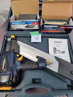 Nailer, case, manual, and two nail boxes displayed in open case