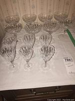 Front view of all 14 crystal stemware pieces arranged in rows on a table.