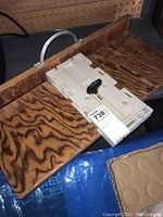 Incra jig on wooden base showing full setup and wood grain pattern.